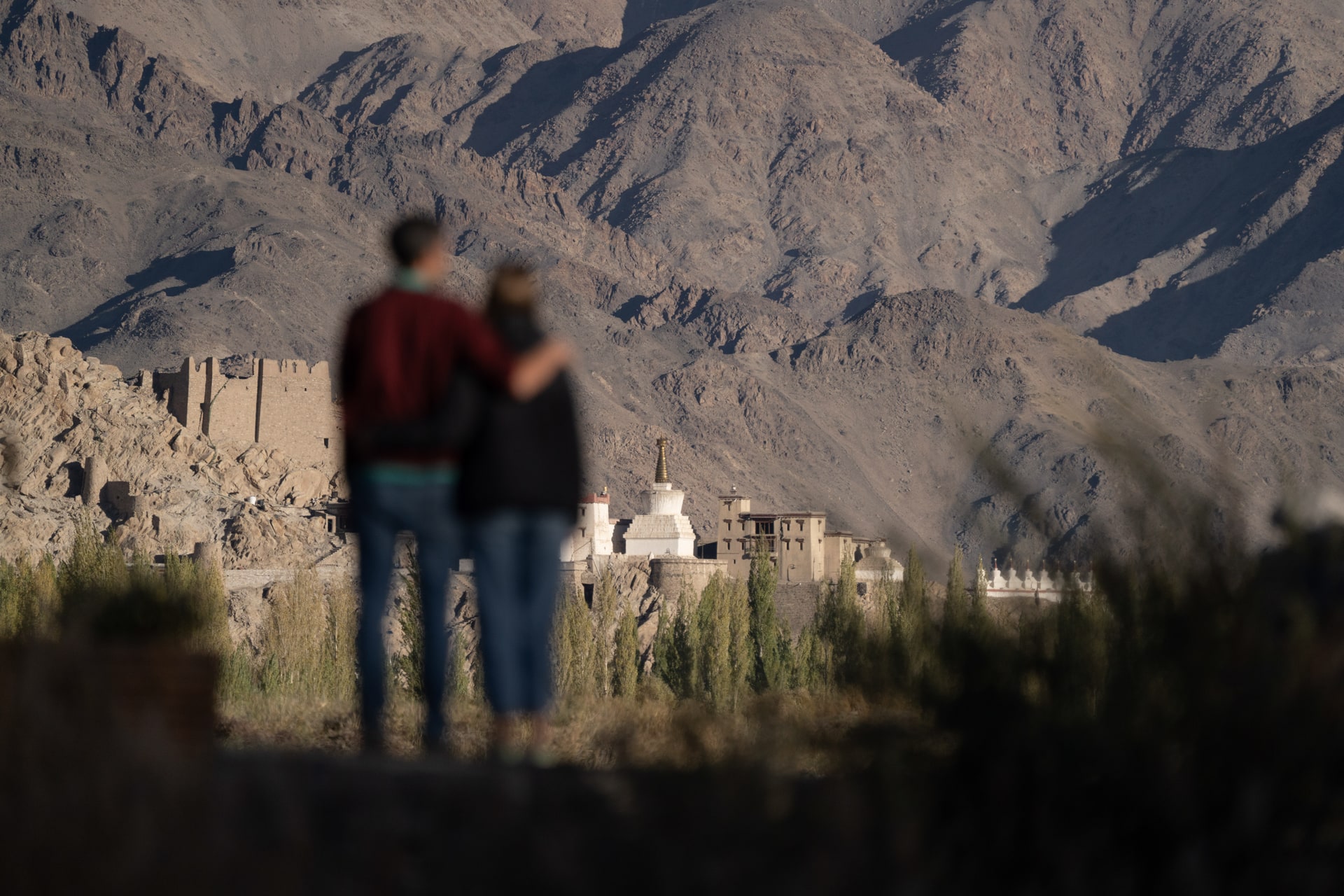 Couple Looking to Shey Palace from Camp